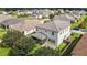 Aerial view of home's backyard featuring screened porch, patio, privacy fence, and landscaped yard at 209 S Harrison Place Ln, Fuquay Varina, NC 27526