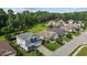 Beautiful homes line the street, surrounded by lush greenery and mature trees, creating a serene neighborhood ambiance at 209 S Harrison Place Ln, Fuquay Varina, NC 27526