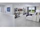 Cozy upstairs bonus room with a large white sofa, entertainment center, and plush carpet at 216 Sprenger St, Garner, NC 27529