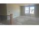 Bright, unfinished room with large windows and views, perfect for customization as a bedroom or office at 216 Sprenger St, Garner, NC 27529