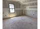 A bedroom under construction with drywall installed and a window to the outside at 240 Noramac Ct, Selma, NC 27576