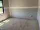 A bedroom under construction with drywall installed and a window to the outside at 240 Noramac Ct, Selma, NC 27576