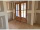 The entryway has wooden french doors leading outside with drywall installed at 240 Noramac Ct, Selma, NC 27576