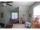 Bedroom with neutral walls and a ceiling fan, complemented by decorative accents and stuffed animals at 2471 Golden Forest Dr, Franklinton, NC 27525