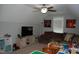 Spacious bonus room with comfortable sofa, TV, and decor at 2471 Golden Forest Dr, Franklinton, NC 27525