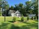Charming one-story home with mature trees and a well-manicured lawn at 2471 Golden Forest Dr, Franklinton, NC 27525
