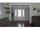 Open foyer featuring hardwood floors and a welcoming front door with sidelights at 2471 Golden Forest Dr, Franklinton, NC 27525