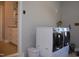 Laundry room area featuring washer and dryer, plus storage cabinets at 2471 Golden Forest Dr, Franklinton, NC 27525
