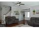 Comfortable living room showcases hardwood floors, neutral paint, and cozy seating at 2471 Golden Forest Dr, Franklinton, NC 27525