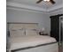 Bedroom with a decorative bed frame, carpet, sliding barn door and bedside table at 2471 Golden Forest Dr, Franklinton, NC 27525