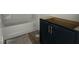 Bathroom featuring a new vanity with gold hardware and a white tub at 257 Marvel Dr # 135, Rolesville, NC 27571