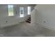 Bright entryway with a staircase, windows, and door leading to a spacious open floor plan at 257 Marvel Dr # 135, Rolesville, NC 27571