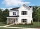 Beautiful rendering of a two-story home with a landscaped yard and inviting front porch at 257 Marvel Dr # 135, Rolesville, NC 27571