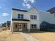 Charming two-story home with white siding, brick accents, and a welcoming front porch at 257 Marvel Dr # 135, Rolesville, NC 27571