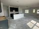 Spacious kitchen with dark cabinets, island, and abundant natural light, perfect for cooking and entertaining at 257 Marvel Dr # 135, Rolesville, NC 27571