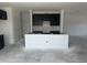Modern kitchen with dark cabinets and island ready for customization, seamlessly integrating into the open-concept layout at 257 Marvel Dr # 135, Rolesville, NC 27571