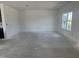 Bright living room offering ample space for customization, with a large window allowing natural light at 257 Marvel Dr # 135, Rolesville, NC 27571