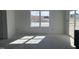 Bright, airy space with large window, bathed in natural light, and ready to be transformed into a cozy living area at 257 Marvel Dr # 135, Rolesville, NC 27571