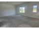 Spacious living room with natural light, offering a versatile space for relaxation and entertainment at 257 Marvel Dr # 135, Rolesville, NC 27571