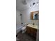 Bathroom features a shower and tub, with a vanity and storage cabinet at 2725 Westchester Dr, Burlington, NC 27217