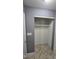 Bedroom closet with a bar for hanging clothes and tile floors at 2725 Westchester Dr, Burlington, NC 27217