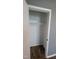 Bedroom closet with a hanging bar and laminate floors at 2725 Westchester Dr, Burlington, NC 27217