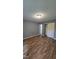 Empty bedroom with wood floors and modern gray walls at 2725 Westchester Dr, Burlington, NC 27217