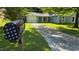 Street view of a home with a well-manicured lawn and driveway, captured from the mailbox at 2725 Westchester Dr, Burlington, NC 27217