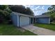 The exterior of this home is light blue with a gray roof and a white garage door at 2725 Westchester Dr, Burlington, NC 27217