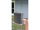 Outdoor AC unit with brick and siding background at 2725 Westchester Dr, Burlington, NC 27217