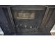 This fireplace has a black metal screen that has decorative oak leaves on the front at 2725 Westchester Dr, Burlington, NC 27217