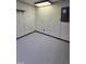 Garage space with concrete floors and electrical panel at 2725 Westchester Dr, Burlington, NC 27217
