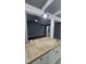 Open concept kitchen with countertop bar overlooking living area at 2725 Westchester Dr, Burlington, NC 27217