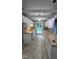 A well-lit kitchen with white cabinets, neutral countertops, and modern lighting fixtures at 2725 Westchester Dr, Burlington, NC 27217
