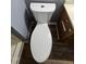 This standard white toilet is featured with chrome fixtures and laminate flooring at 2725 Westchester Dr, Burlington, NC 27217