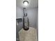 Compact utility room with water heater and storage shelf at 2725 Westchester Dr, Burlington, NC 27217