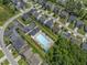 An aerial view of a neighborhood with community pool, showing the layout and surrounding greenery at 274 Marsh Creek Dr, Garner, NC 27529