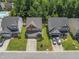 Aerial view of the two-story home in a residential neighborhood with well-kept lawns at 274 Marsh Creek Dr, Garner, NC 27529