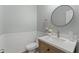 Powder room featuring wainscoting, light-colored walls, and stylish sink at 274 Marsh Creek Dr, Garner, NC 27529