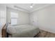 Well-lit bedroom with neutral paint, hardwood flooring, ceiling fan, and closet at 274 Marsh Creek Dr, Garner, NC 27529