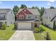 Charming two-story home featuring a two-car garage, well-maintained lawn and beautiful landscaping at 274 Marsh Creek Dr, Garner, NC 27529