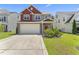Charming two-story home with a large driveway, two-car garage, and well-manicured lawn at 274 Marsh Creek Dr, Garner, NC 27529
