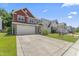 Charming two-story home with a large driveway, two-car garage, and well-manicured lawn at 274 Marsh Creek Dr, Garner, NC 27529