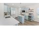 Beautiful kitchen with white countertops, blue cabinets, stainless steel appliances, and an island at 274 Marsh Creek Dr, Garner, NC 27529