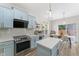 Bright kitchen features shaker cabinets, subway tile backsplash, stainless steel appliances, and quartz countertops at 274 Marsh Creek Dr, Garner, NC 27529