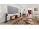 Spacious living room with a large screen, modern media center and seamless flow to other spaces at 274 Marsh Creek Dr, Garner, NC 27529