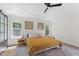 Bright main bedroom with a ceiling fan and large windows bringing in natural light at 274 Marsh Creek Dr, Garner, NC 27529