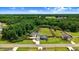 Scenic aerial view of the property showcasing its vast, verdant surroundings and peaceful, residential setting in the distance at 282 Brodie Rose Landing Way, Smithfield, NC 27577