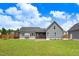 Expansive backyard view, showcasing the home's exterior and outdoor living space at 282 Brodie Rose Landing Way, Smithfield, NC 27577