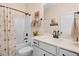 Well-lit bathroom with a shower-tub combo and single sink vanity with a modern design at 282 Brodie Rose Landing Way, Smithfield, NC 27577